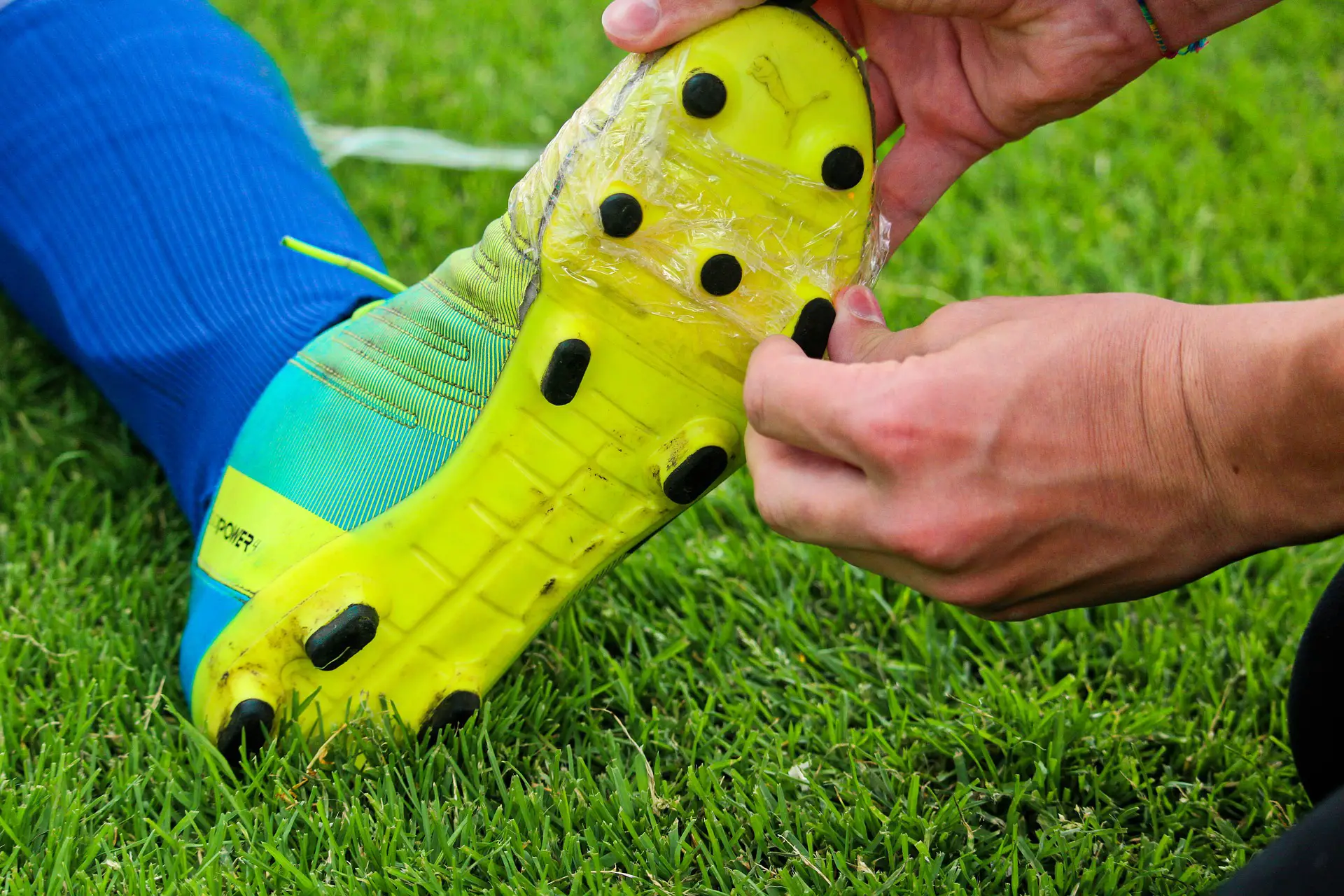 Taping up football boots
